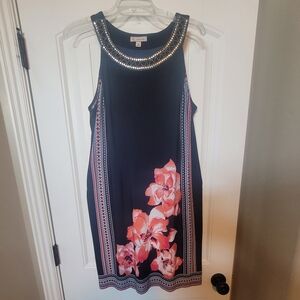 Dress Barn navy blue, sleeveless dress with floral pattern.